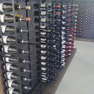 a wine rack with many bottles of wine