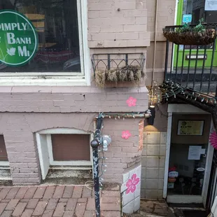 The entrance is down under the stairs. Ring doorbell for pickup during COVID.