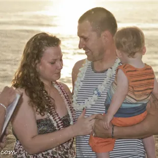 Happy family ceremony, with a passing shower to bless the occaision