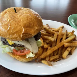 a hamburger and fries on a plate