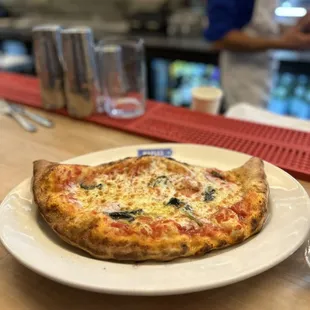 a pizza on a white plate