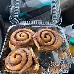 cinnamon buns in a container