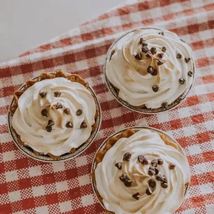 Mini chocolate meringue pies.