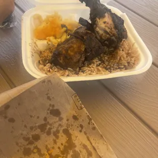 a chicken and rice meal in a styrofoam container