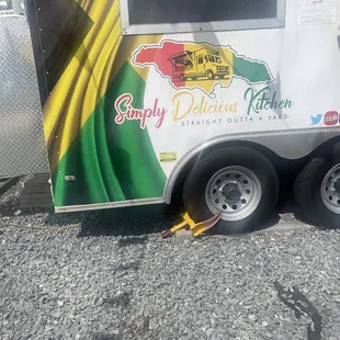 a food trailer with a flag on the side