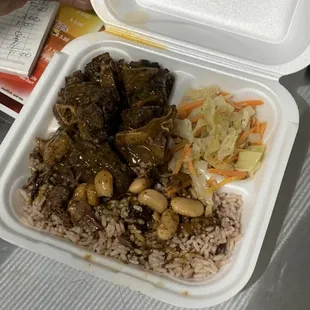 #oxtail/rice and peas, cabbage and carrot.
