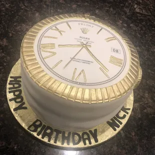 Rolex themed lemon cake with lemon buttercream and raspberry filling.