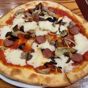 a pizza on a white plate