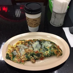 an omelet and a cup of coffee