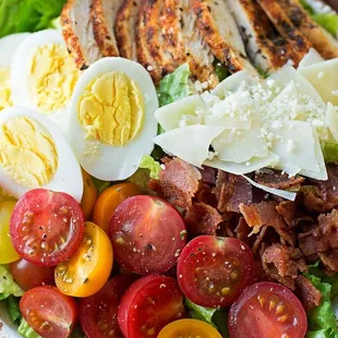 Asiago Cheese, grilled chicken, Cherry tomatoes, eggs and bacon.