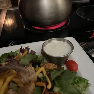 Salad with bleu cheese. Swiss cheese melting in the background for our next course.