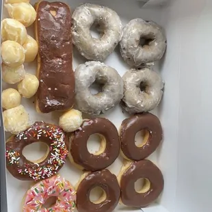Blueberry cake, chocolate, sprinkles, long John with crème, glazed holes