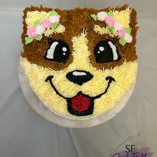 a dog face on a cake