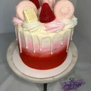 a cake with strawberries and marshmallows
