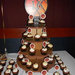 a tiered display of cupcakes