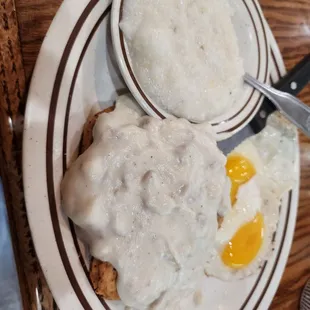 a plate of fried eggs and gravy