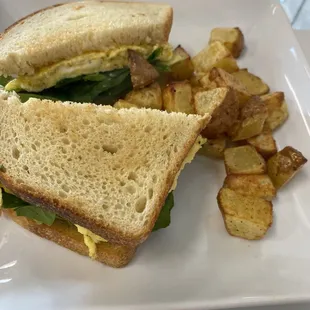 Egg and avocado breakfast sandwich - comes with potatoes.