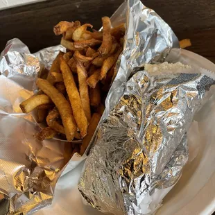 a sandwich and french fries on a plate