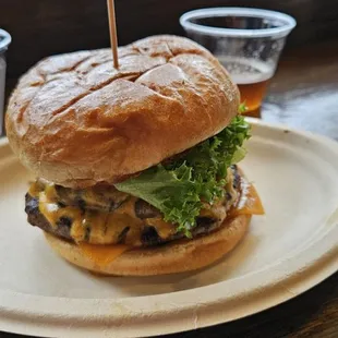 Cheddar cheese burger with grilled marinated onions and mushrooms