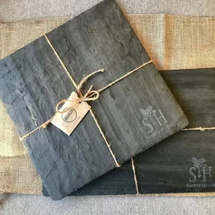 a pair of slate coasters wrapped in twine