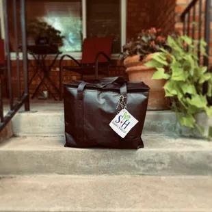 a tote bag on the steps of a house