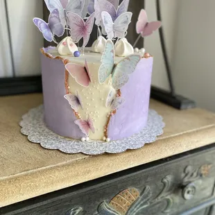 Butterfly Kisses - #MadeFromScratch 8" round, 3 layer cake with #homemade buttercream icing.  Frontal fault line explodes with butterflies.