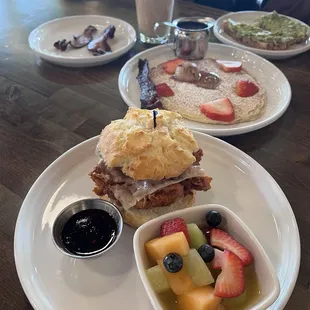 Crispy Chicken Biscuit, Kids Pancake with Cinnamon Butter, Avocado Toast with Extra Bacon, and an Iced Latte