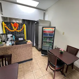 a small dining area with tables and chairs