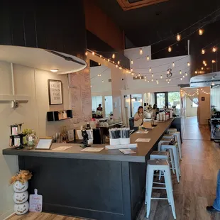 a view of a restaurant with a counter and bar