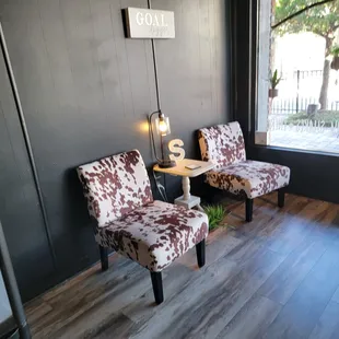 two chairs in front of a window