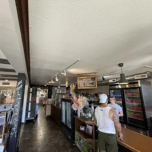 two men standing at the counter