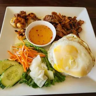 Broken rice with egg, pork and shrimp .