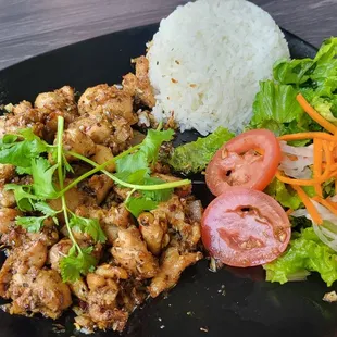 a plate of food with rice and vegetables