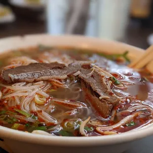 a bowl of beef and noodles