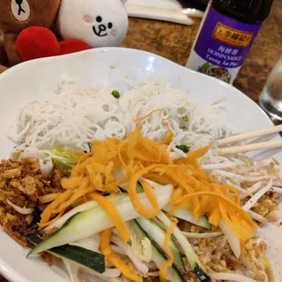 B12 - three choices combo includes vermicelli, garlic chips, cucumber, picked carrots, bean sprouts, and chopped peanuts