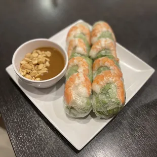 a plate of food with dipping sauce
