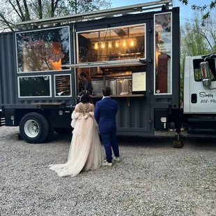 a bride and groom getting ready for their wedding