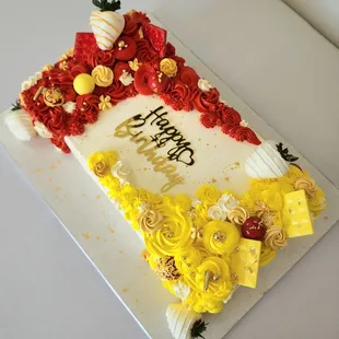 This fun sheet cake was truly created to celebrate it recipients. One loves red, the other yellow...both captured.