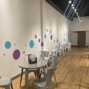 a row of tables and chairs