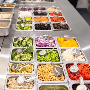 a variety of salads in trays
