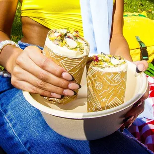 a woman holding a plate of food