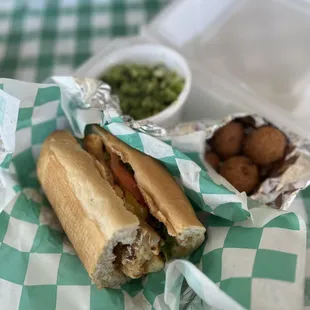 Grilled Cod Po Boy: includes lettuce, tomato, Remoulade. Broccoli and cheese + hush puppies on the side.