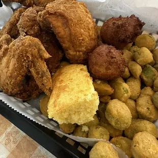 Fried Chicken (4 pieces) and hush puppies with fried okra, corn bread.
