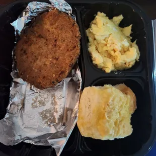 A salmon patty (as in one) scrambled eggs and homemade biscuit