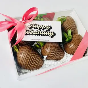 chocolate covered strawberries in a clear box