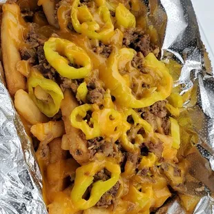 Simply Cheesesteak Fries. Added banana peppers