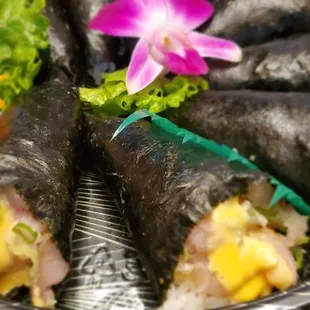 a plate of sushi rolls on a table