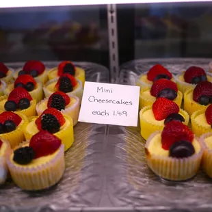a display of mini cheesecakes