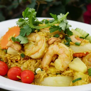 Pineapple Fried Rice - Stir fried rice with egg, pineapple, cashew nuts, onion, carrots, curry powder