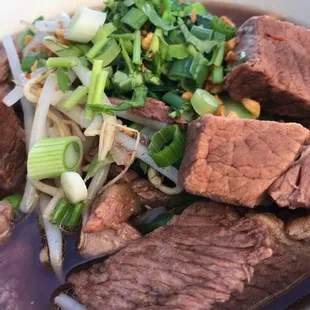 Beef Stew Noodles # 1 - Beef stewed in dark broth topped with fried garlic, scallion, cilantro